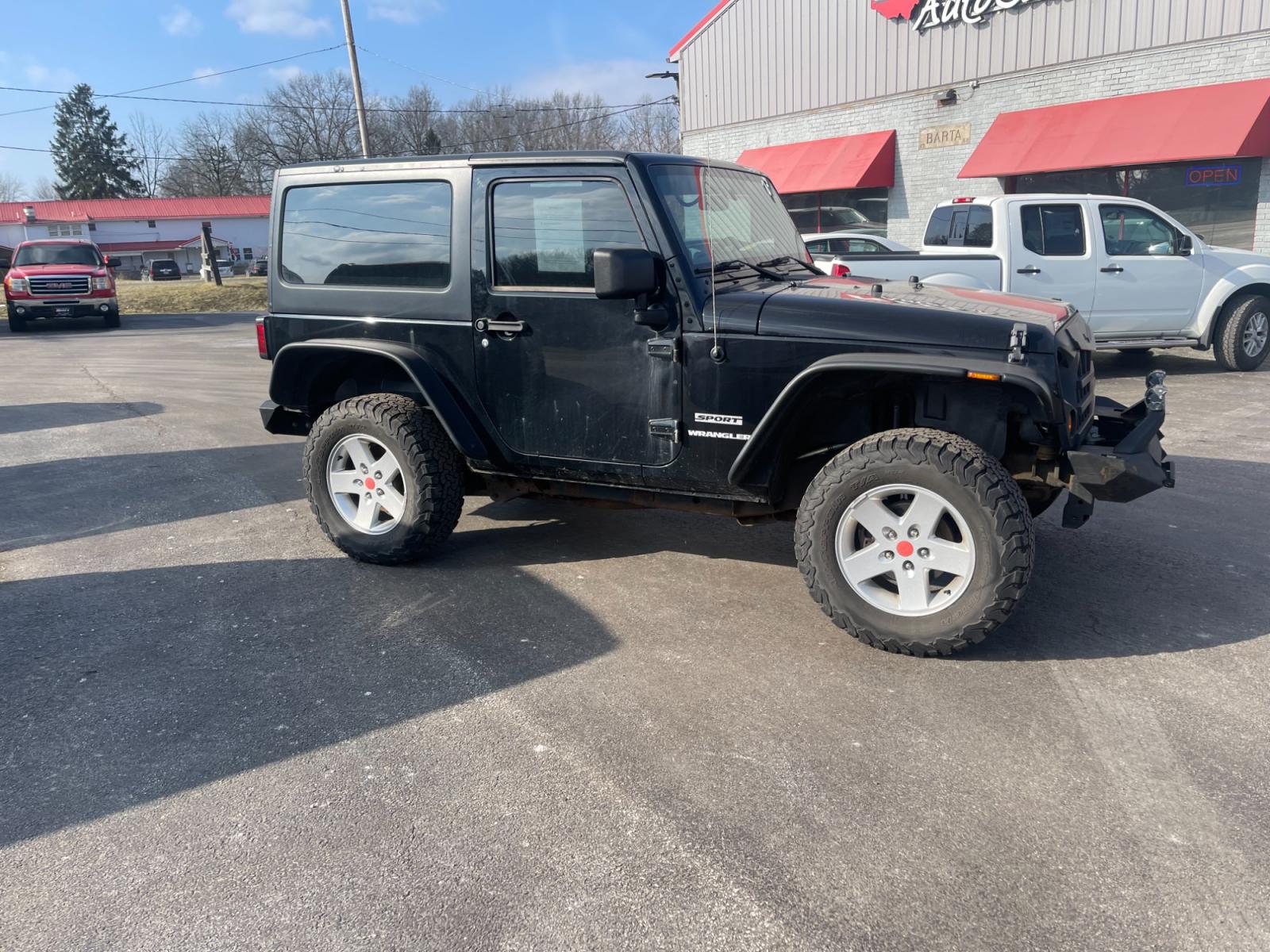 2013 Black /Black Jeep Wrangler Sport 4WD (1C4AJWAG0DL) with an 3.6L V6 DOHC 24V FFV engine, 6 Speed Manual transmission, located at 547 E. Main St., Orwell, OH, 44076, (440) 437-5893, 41.535435, -80.847855 - This 2013 Jeep Wrangler Sport 4WD, equipped with a robust 3.6L Pentastar V6 engine and a 6-speed manual transmission, represents a premium blend of performance and rugged capability. Its Trail Rated designation underscores a commitment to off-road excellence, featuring modifications such as LED head - Photo #3